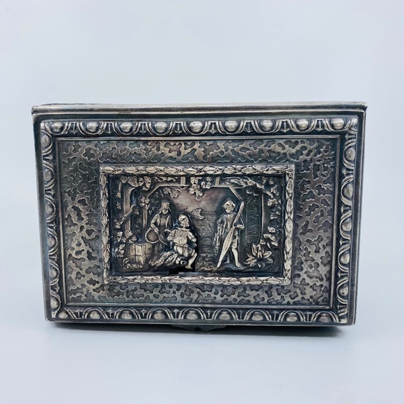Antique pewter repousse, wood lined hinged, footed box.